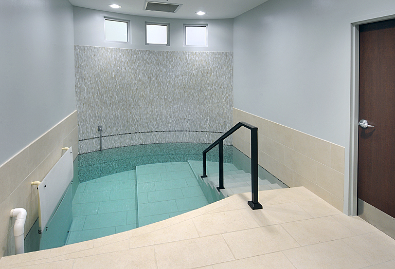 The tiled steps and living waters of the MACoM mikvah