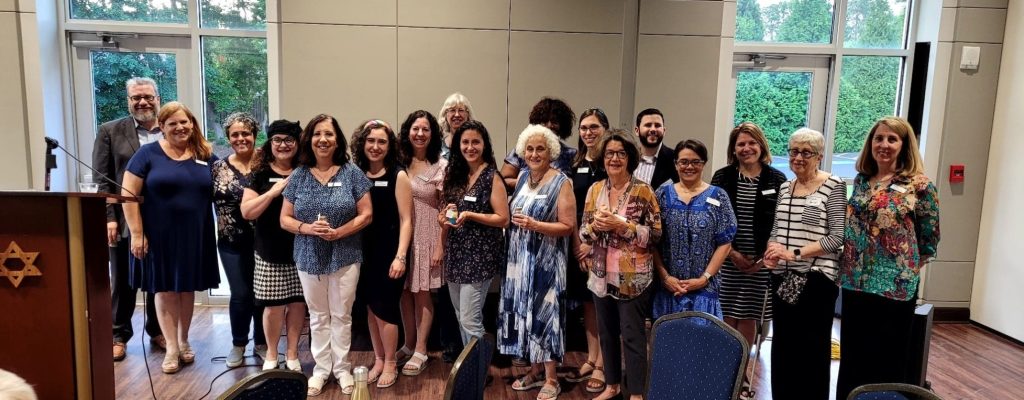 MACoM mikvah guides gathered together in 2023